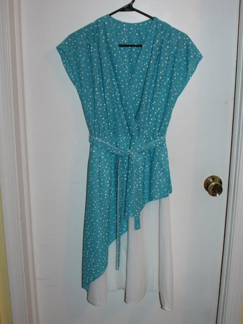 Vintage blue & white patterned sleeveless dress with a wrap-style top